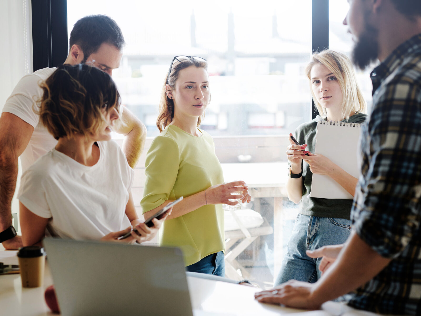A team working out plans together around a table